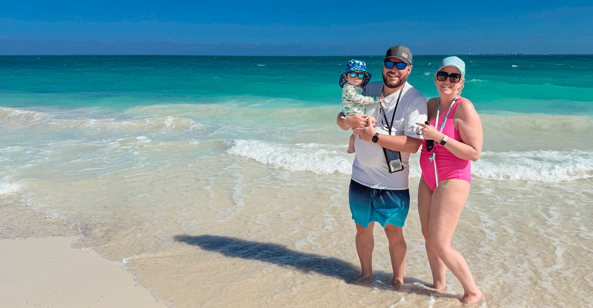 Axel, Dad, and Mom on the beach in Mexico