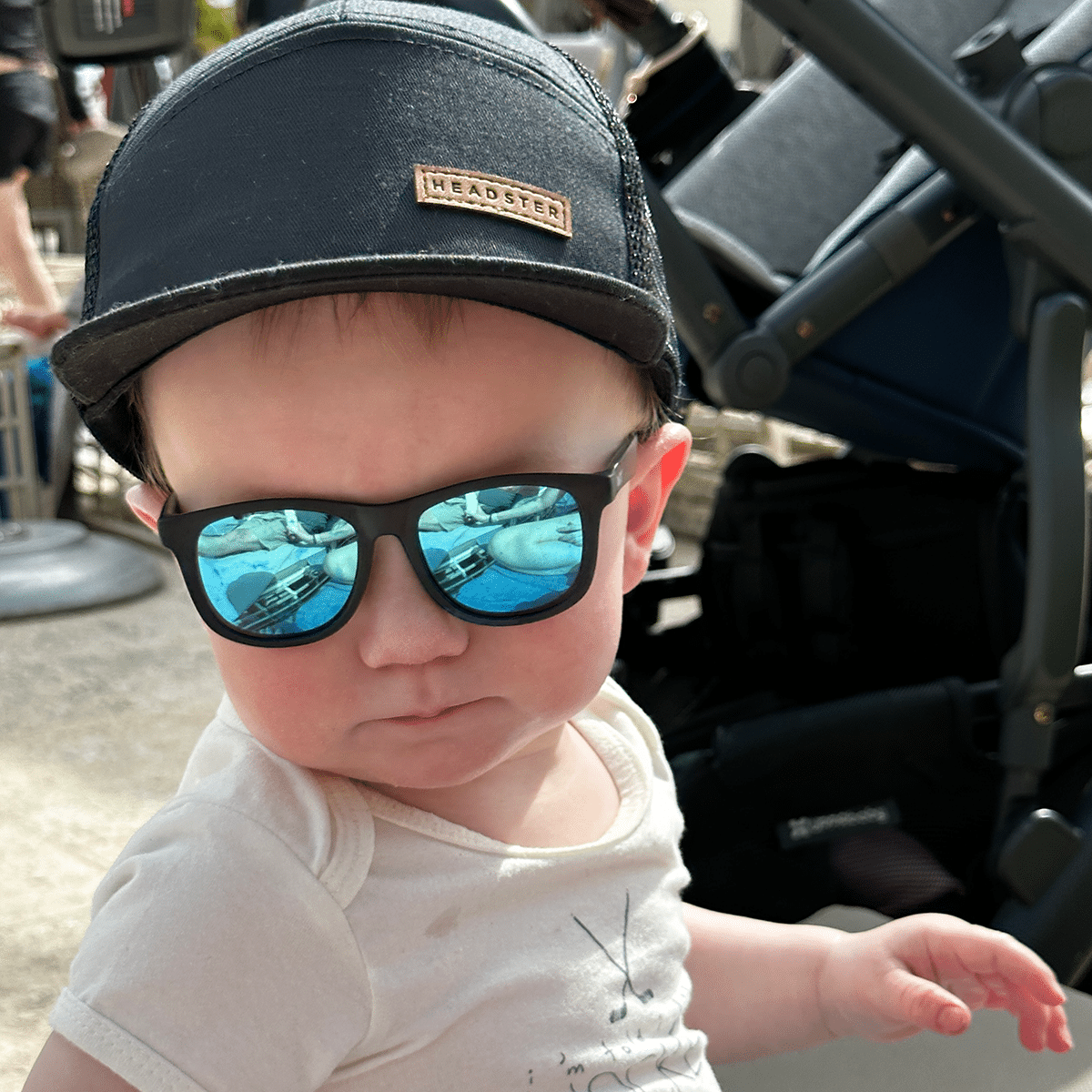 Axel relaxing poolside at the resort. After sometime he enjoyed wearing his sunglasses.